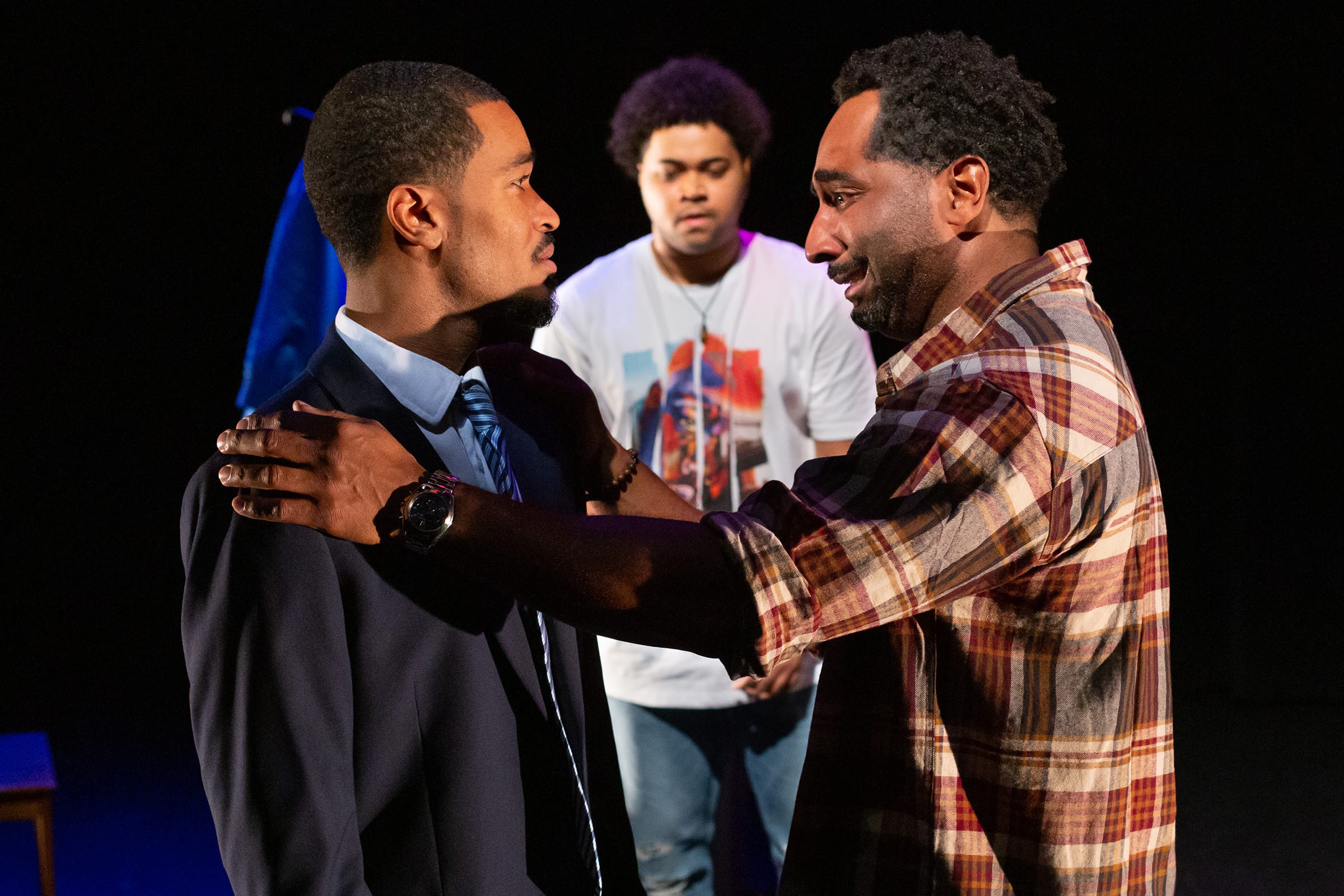 Three members of the Negro Ensemble Company perform a dramatic piece on stage