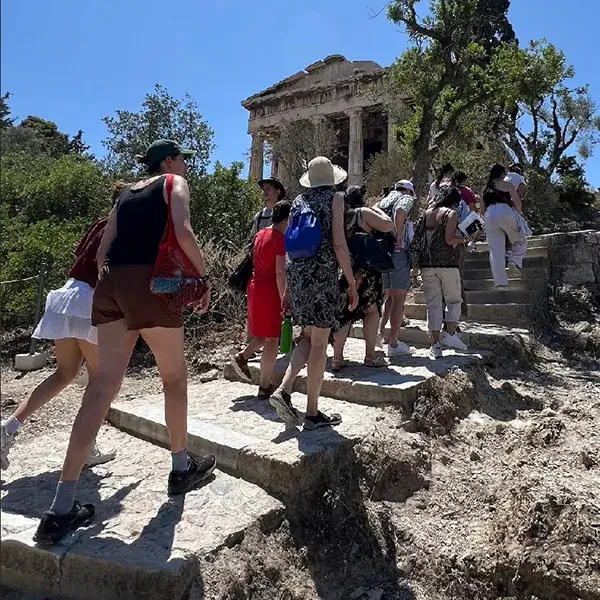 Students in the SNF Paideia Program climb an ancient staircase during their trip to Athens.