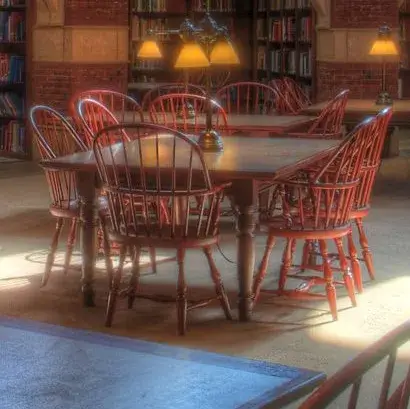 A table surrounded by chairs inside Fisher Fine Arts Library at the University of Pennsylvania.