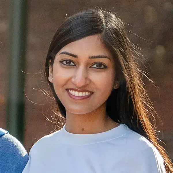 Shreya Krishnan, W’26, smiling in a portrait headshot